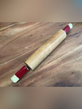 Vtg. American style wooden rolling pin with red and cream painted handles.
